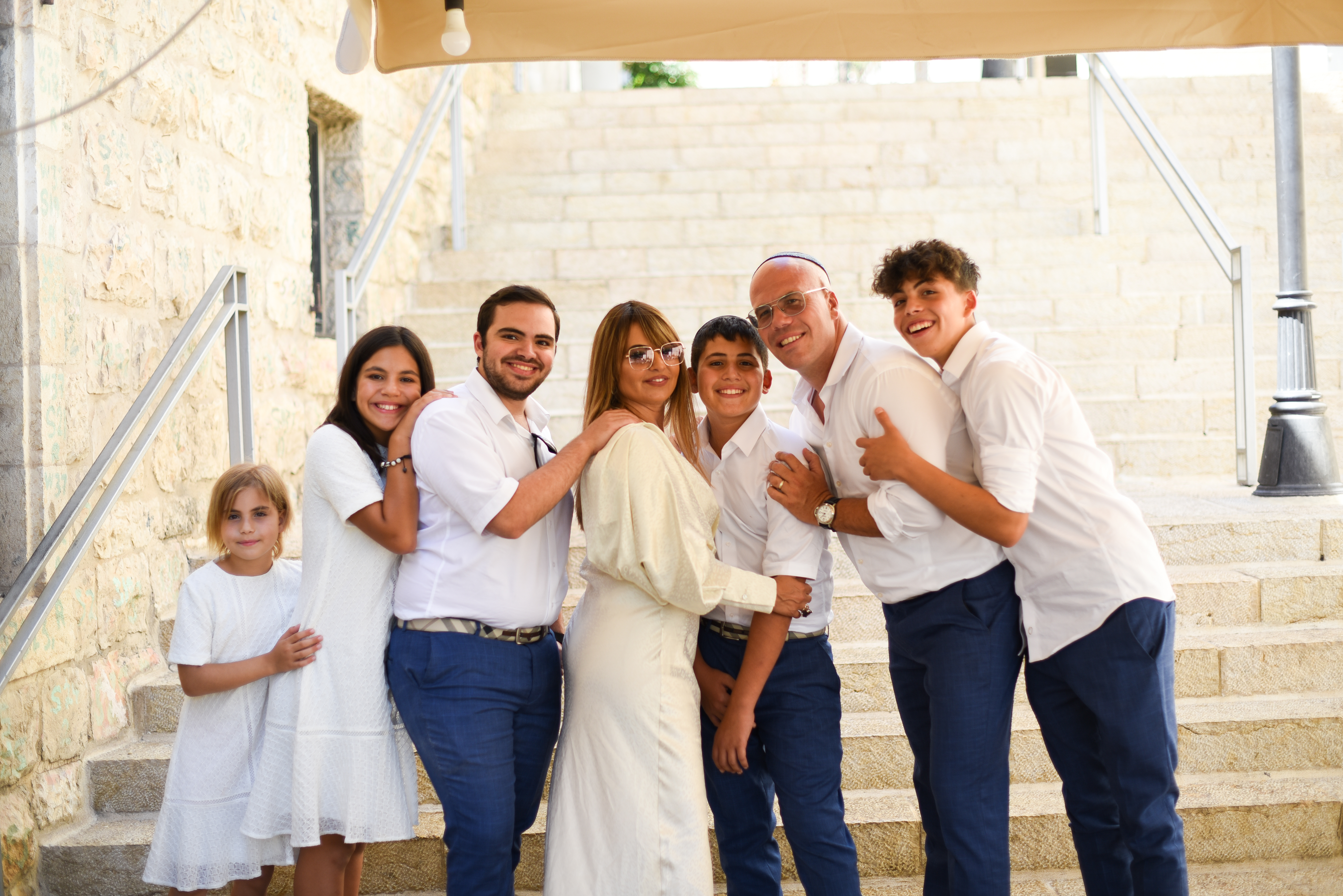 Photo of get fit ima with her familly in front of stairs